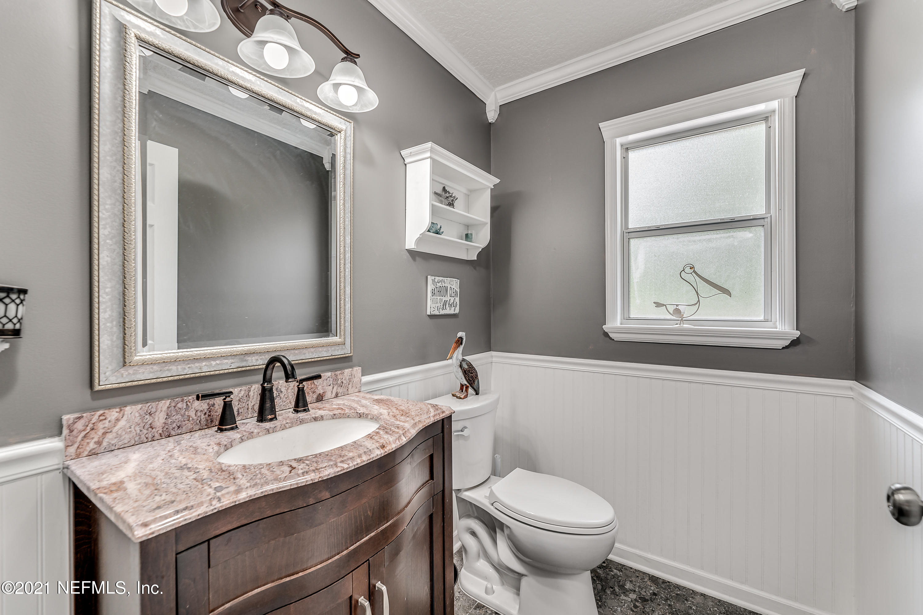 1123 Cactus Cut Road Middleburg, FL 32068 - Photo 36 of 66 a bathroom with a granite countertop toilet a sink and a mirror