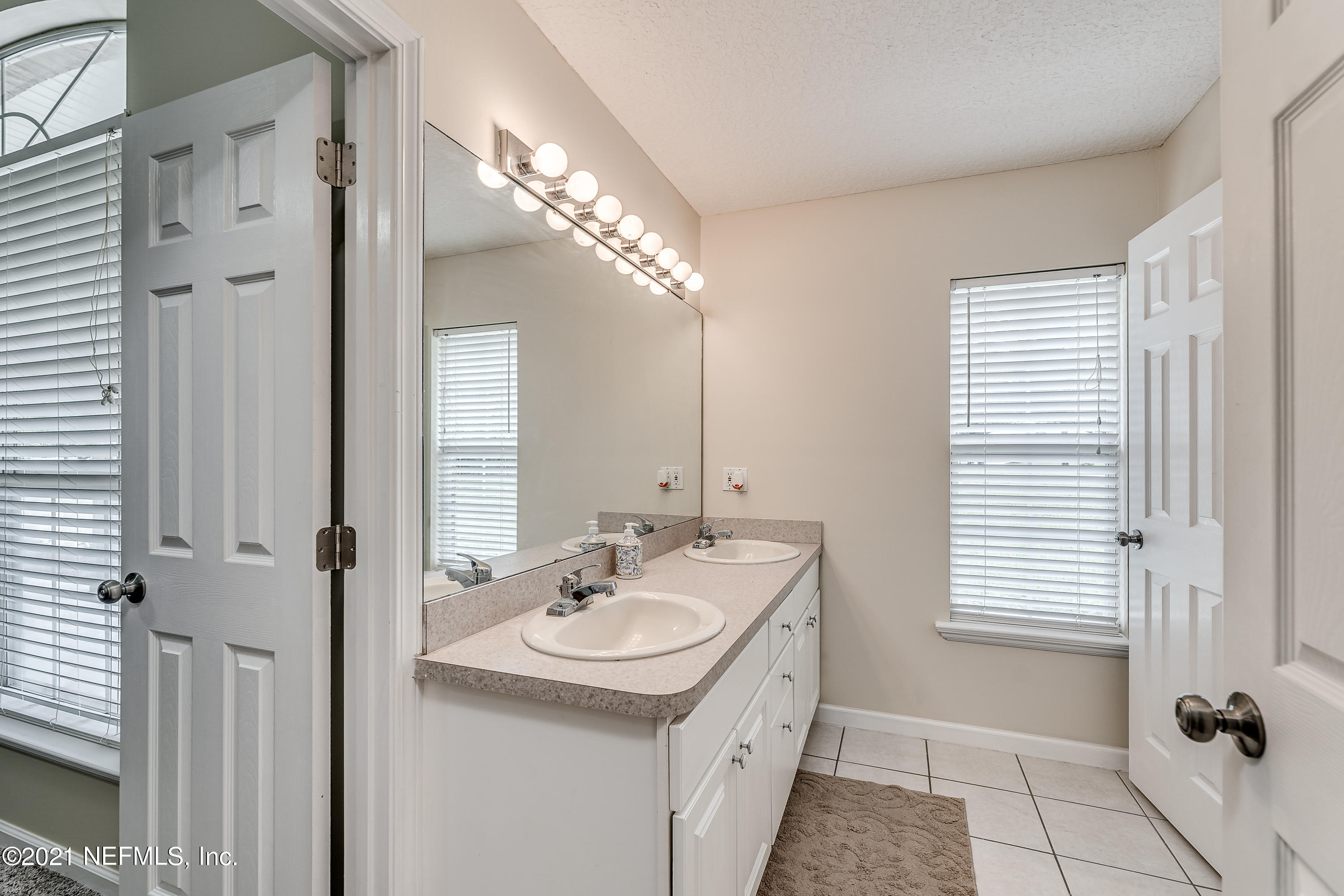 1123 Cactus Cut Road Middleburg, FL 32068 - Photo 48 of 66 a bathroom with a sink and a mirror