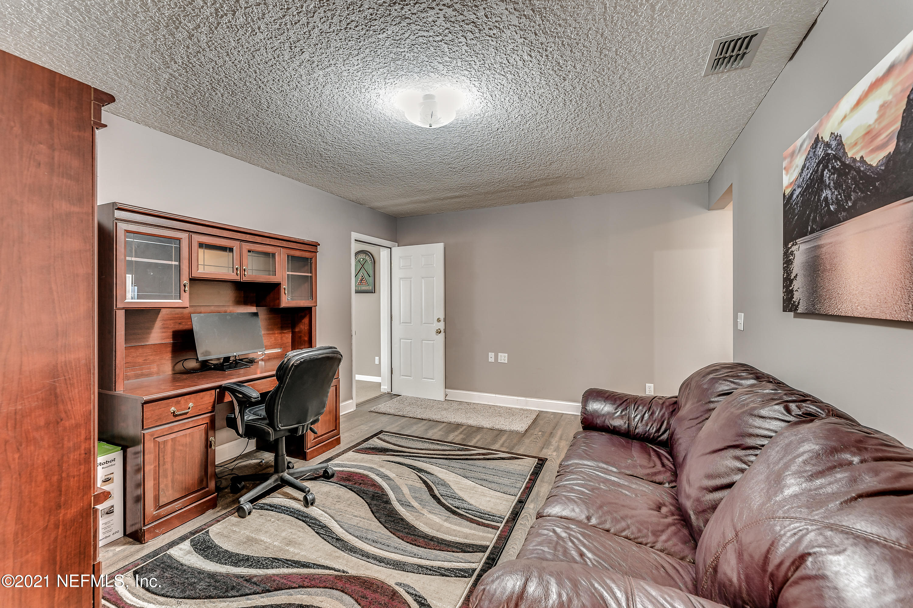 1123 Cactus Cut Road Middleburg, FL 32068 - Photo 50 of 66 a view of a livingroom with workspace and a couch
