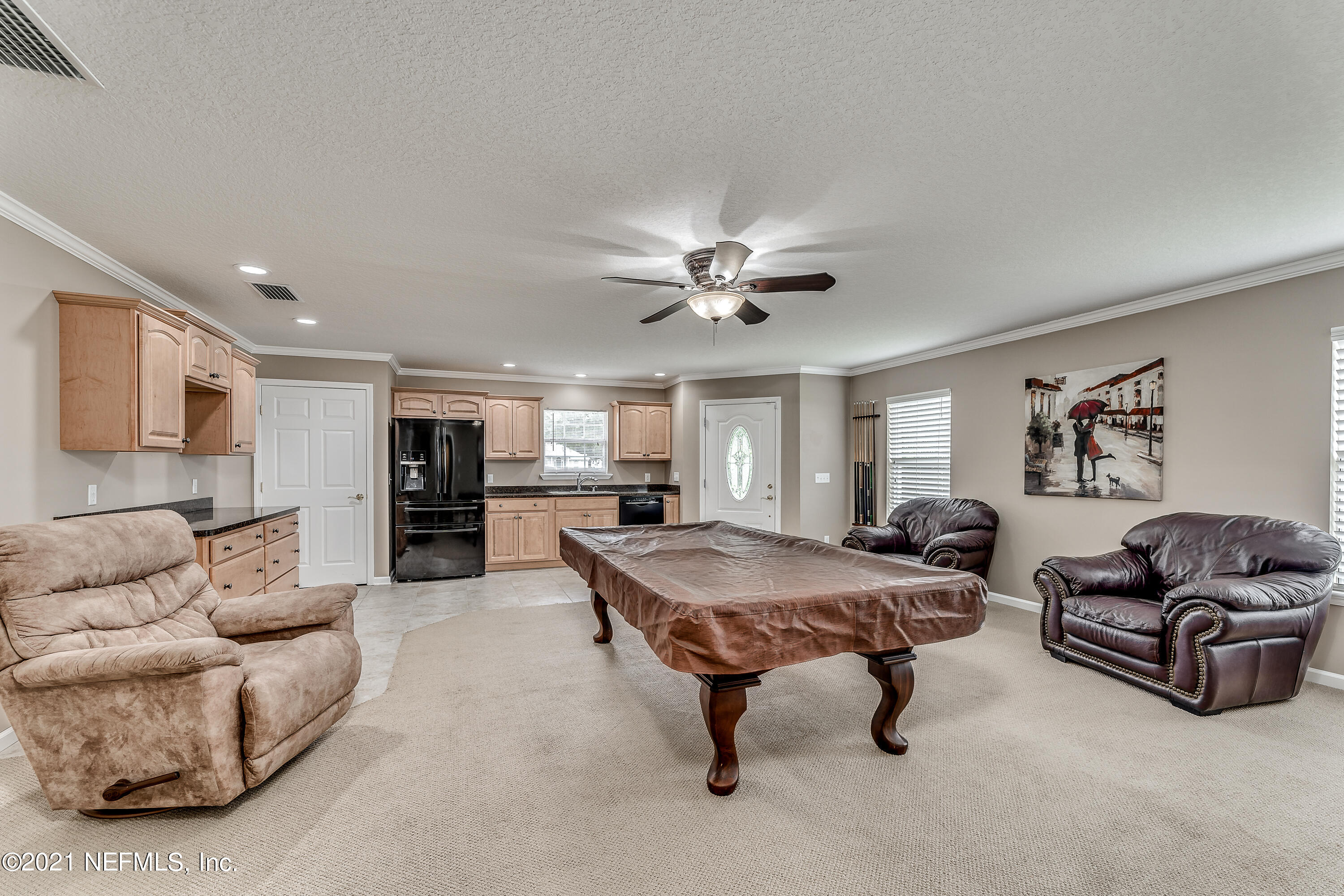1123 Cactus Cut Road Middleburg, FL 32068 - Photo 53 of 66 a living room with furniture and kitchen view