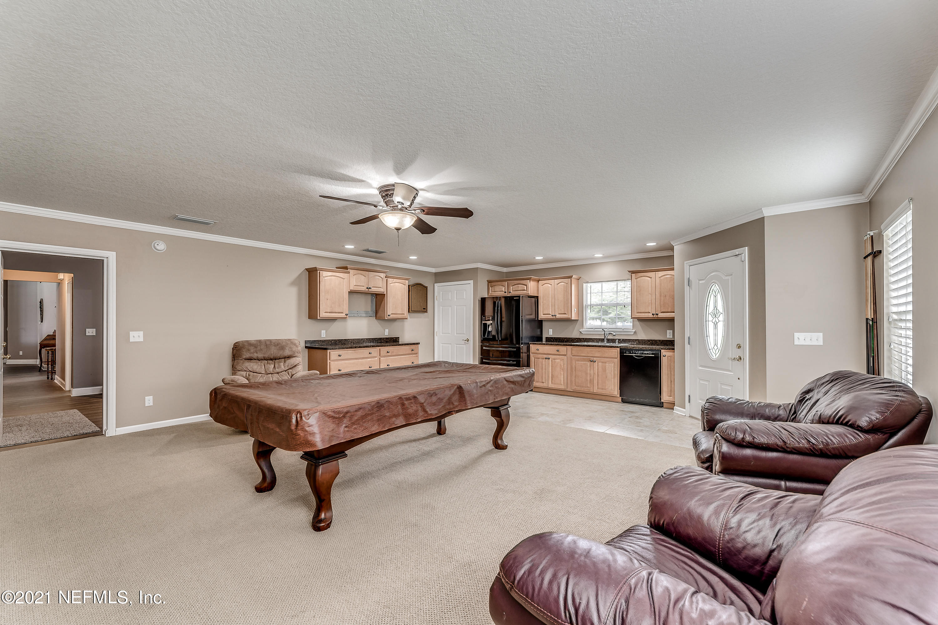 1123 Cactus Cut Road Middleburg, FL 32068 - Photo 54 of 66 a living room with furniture and kitchen view