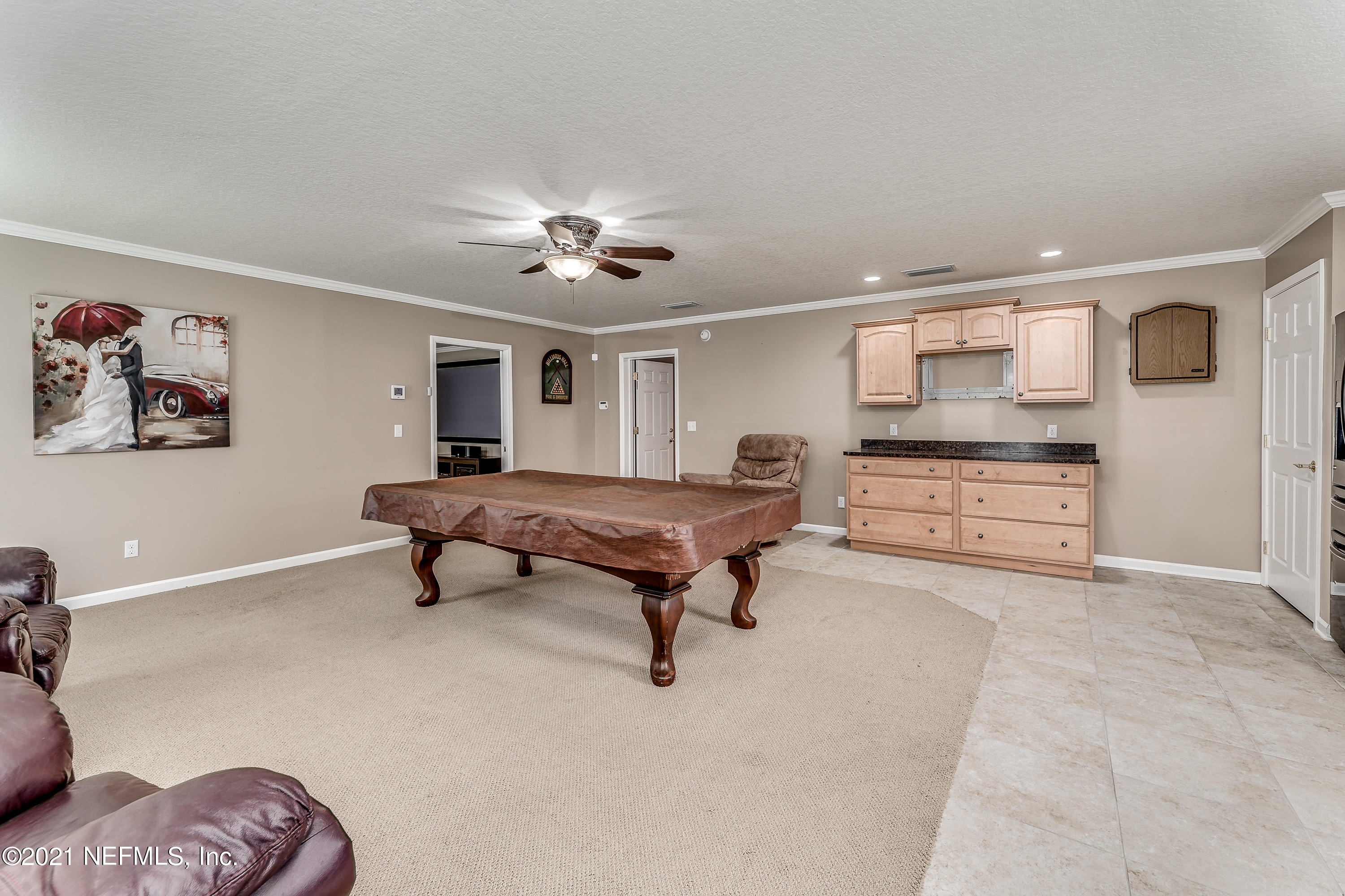 1123 Cactus Cut Road Middleburg, FL 32068 - Photo 55 of 66 a room with furniture and a chandelier