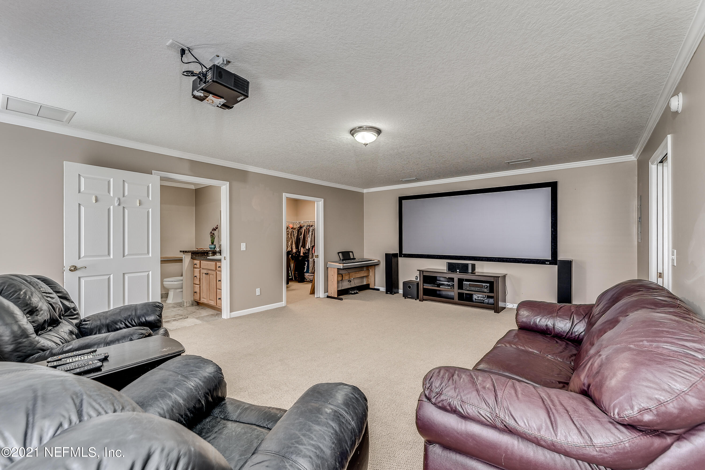 1123 Cactus Cut Road Middleburg, FL 32068 - Photo 60 of 66 a living room with furniture and a flat screen tv