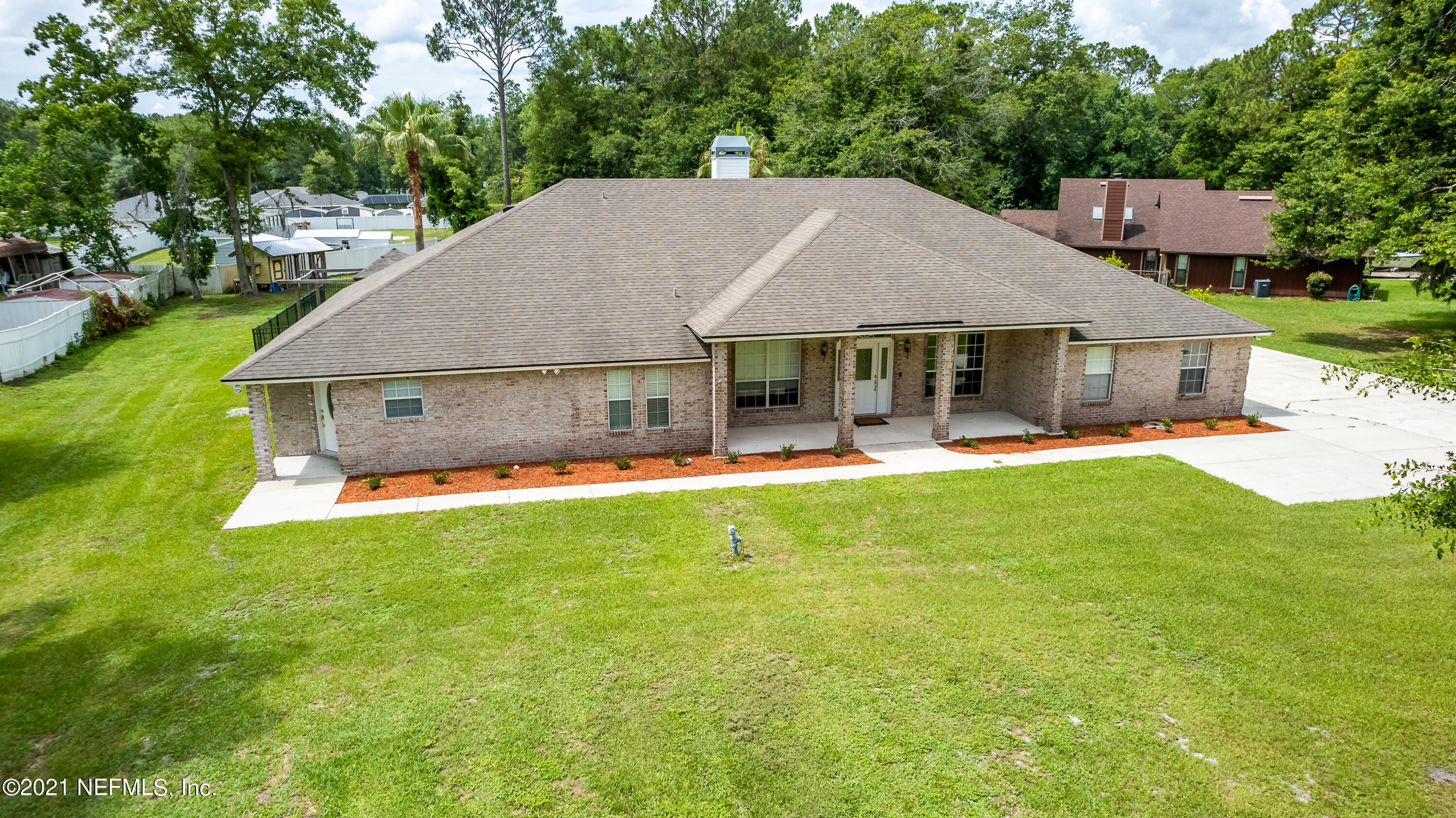 1123 Cactus Cut Road Middleburg, FL 32068 - Photo 6 of 66 a aerial view of a house with swimming pool and porch with furniture