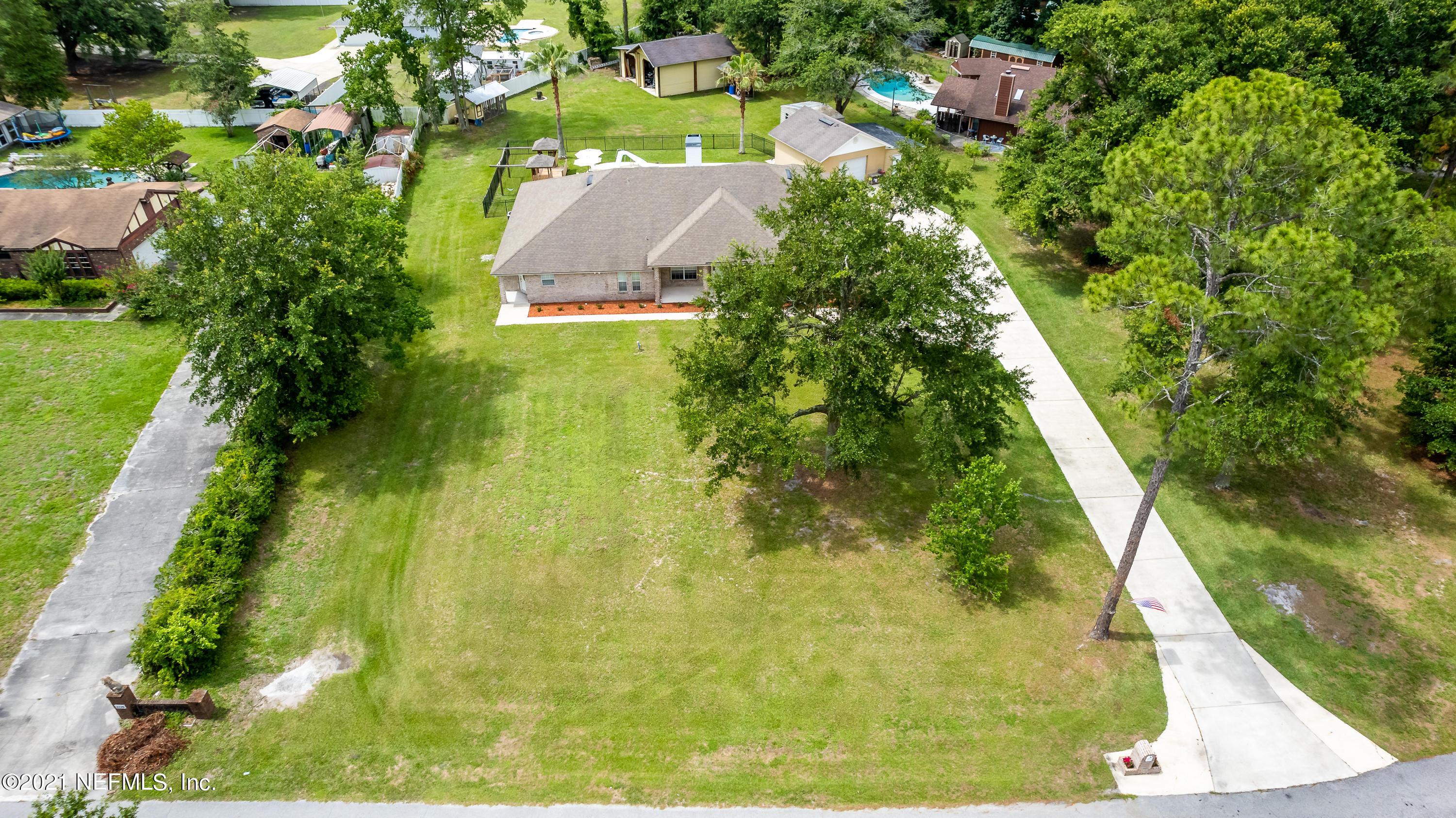 1123 Cactus Cut Road Middleburg, FL 32068 - Photo 64 of 66 an aerial view of residential houses with outdoor space
