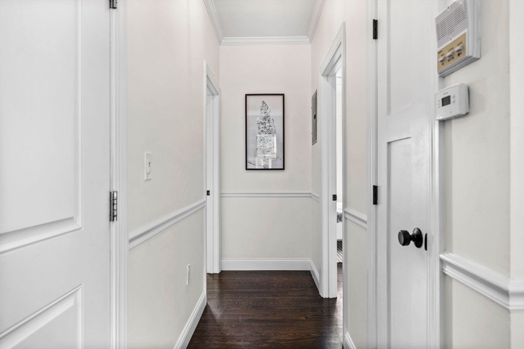 296 East 8th Street, Unit 3 Boston, MA 02127 - Photo 12 of 29 a view of a hallway with wooden floor and entryway
