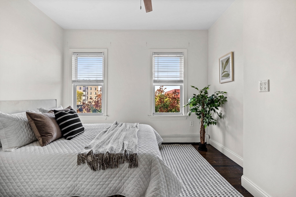 296 East 8th Street, Unit 3 Boston, MA 02127 - Photo 13 of 29 a bedroom with a bed and a window
