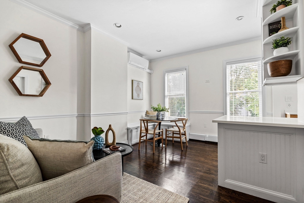 296 East 8th Street, Unit 3 Boston, MA 02127 - Photo 2 of 29 a living room with furniture and wooden floor