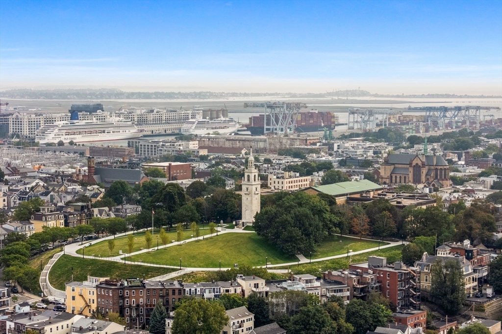 296 East 8th Street, Unit 3 Boston, MA 02127 - Photo 28 of 29 an aerial view of residential houses with outdoor space and swimming pool