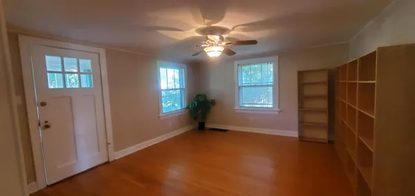 a view of an empty room with a window