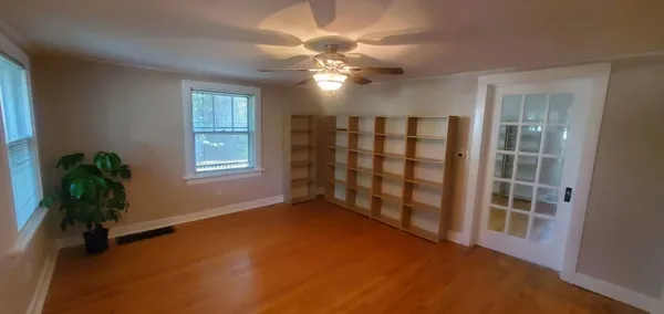 a view of an empty room with a window