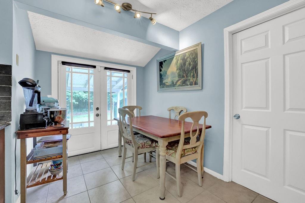 1555 Rock Springs Road Buford, GA 30519 - Photo 11 of 27 a view of a dining room with furniture and a window