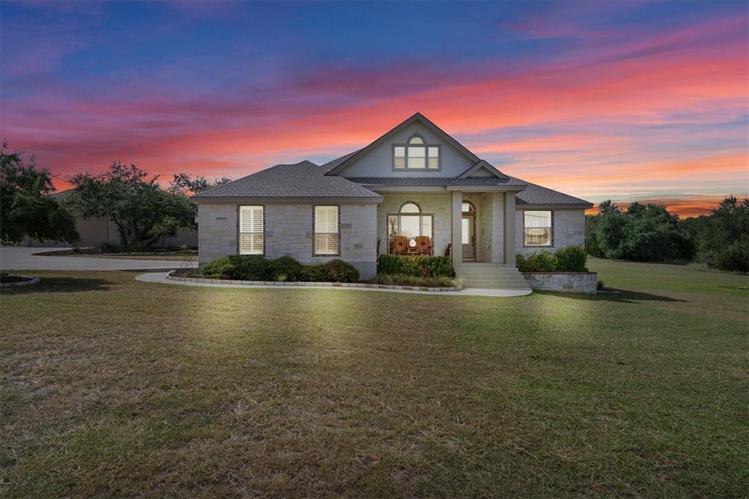 a front view of a house with a yard