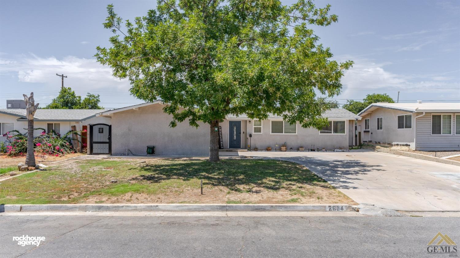 Undisclosed Address Bakersfield, CA 93305 - Photo 1 of 33 a front view of a house with a yard