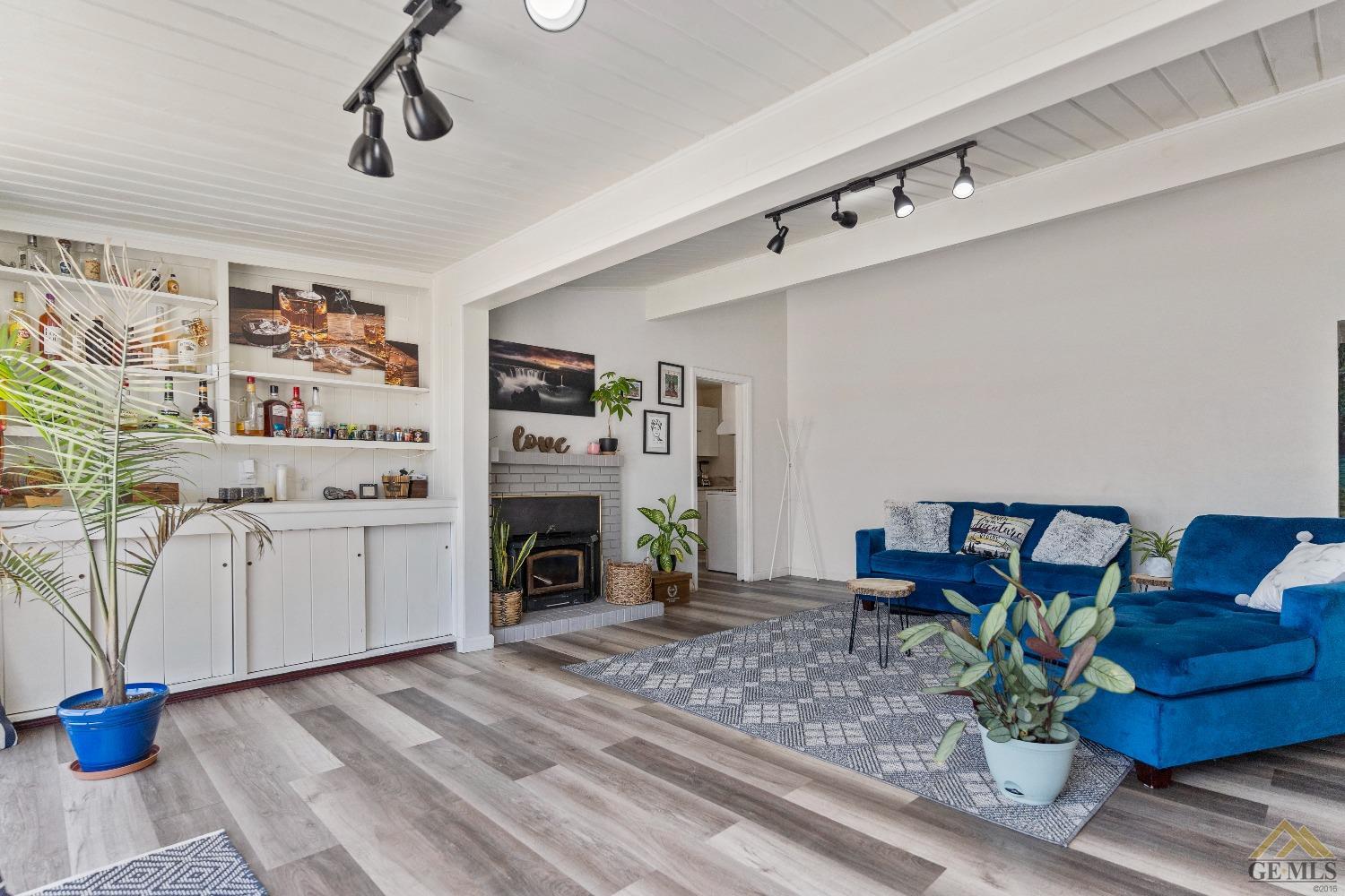 Undisclosed Address Bakersfield, CA 93305 - Photo 12 of 33 a living room with furniture and a fireplace