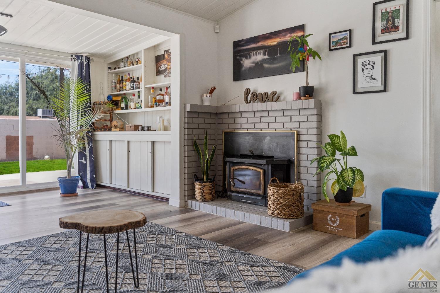 Undisclosed Address Bakersfield, CA 93305 - Photo 30 of 33 a living room with furniture and a fireplace