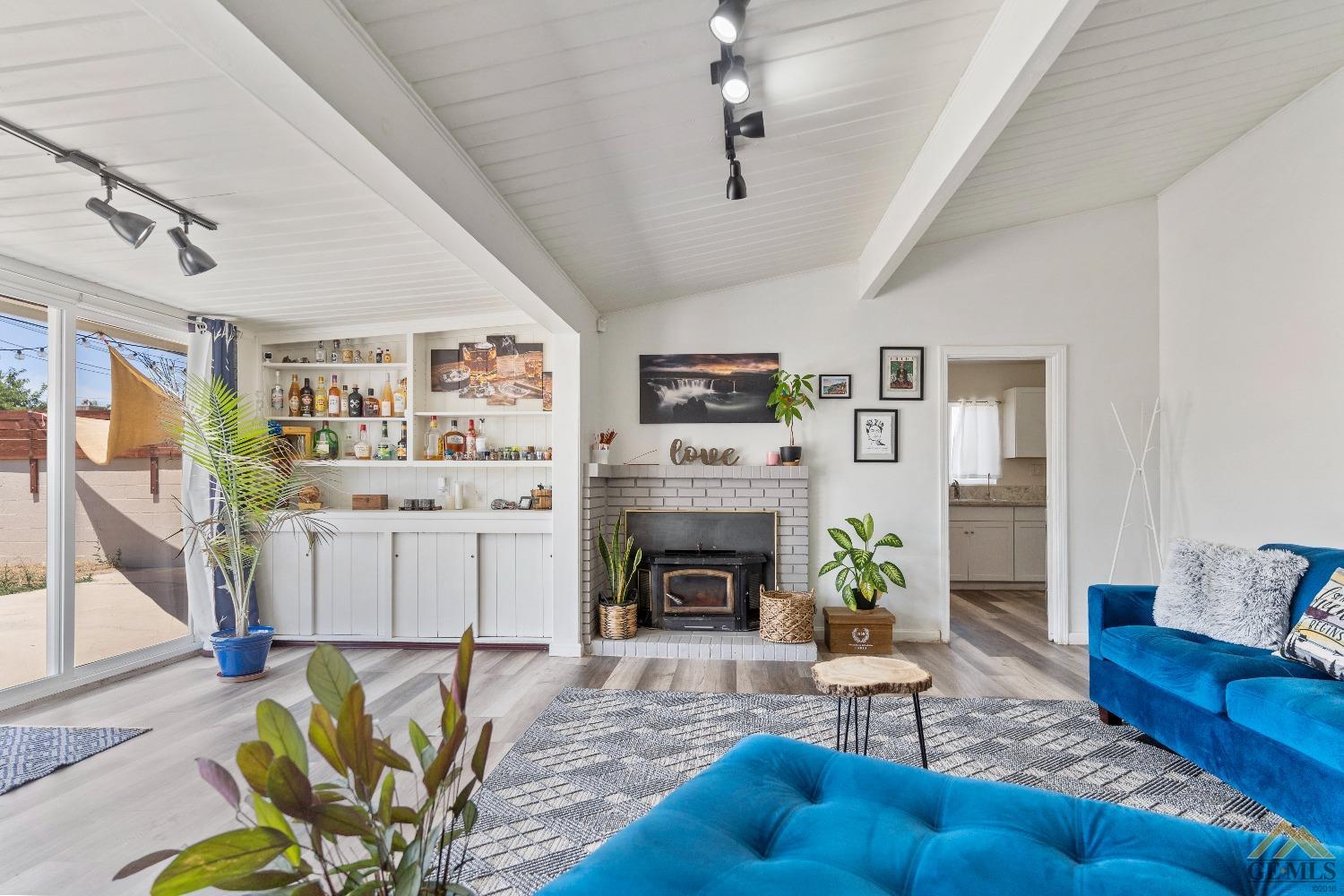 Undisclosed Address Bakersfield, CA 93305 - Photo 7 of 33 a living room with furniture and a fireplace