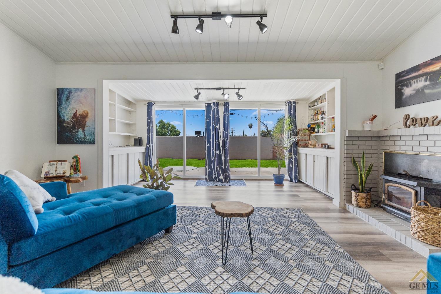 Undisclosed Address Bakersfield, CA 93305 - Photo 8 of 33 a living room with furniture and a flat screen tv