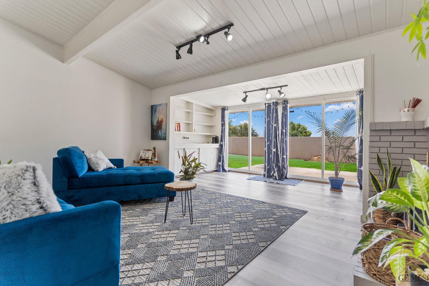 Undisclosed Address Bakersfield, CA 93305 - Photo 9 of 33 a living room with furniture and a wooden floor