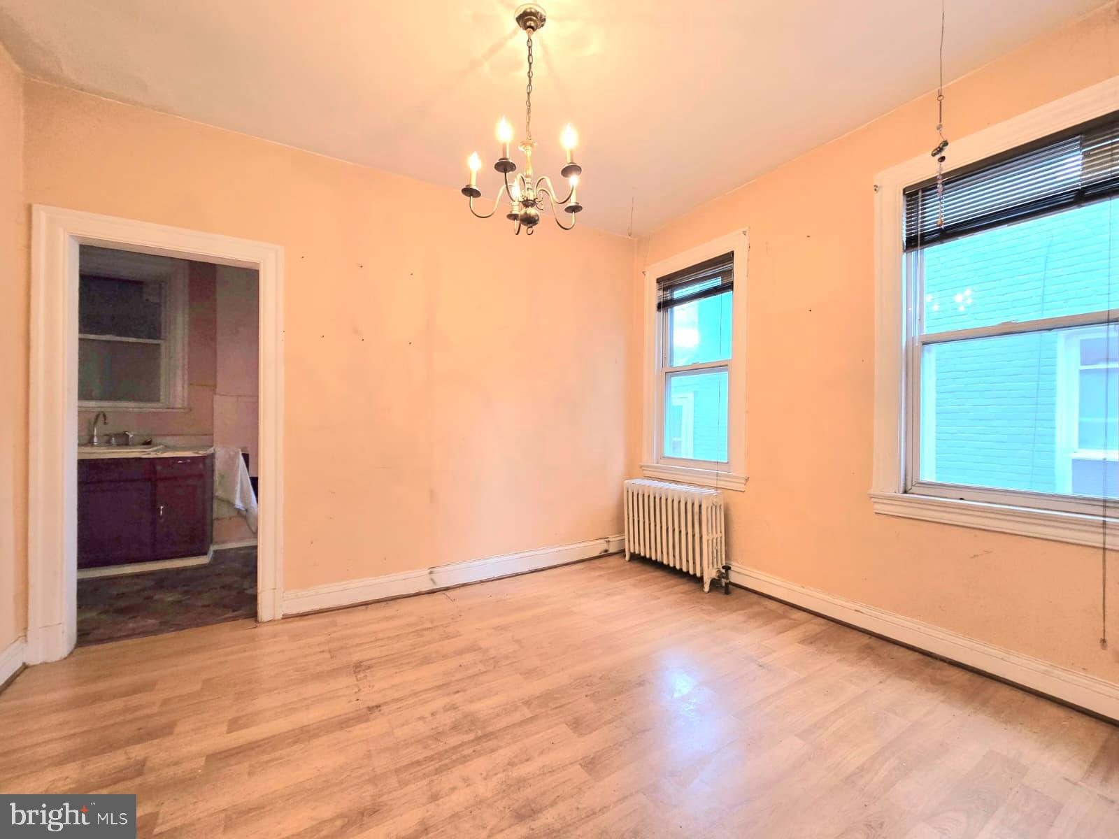 613 Roxboro Place Northwest Washington, DC 20011 - Photo 6 of 17 an empty room with windows and cabinet