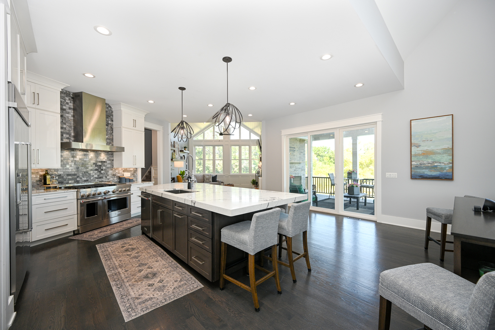 5-n107 Burr Road St. Charles, IL 60175 - Photo 12 of 54 a large kitchen with granite countertop a stove a sink a dining table and chairs