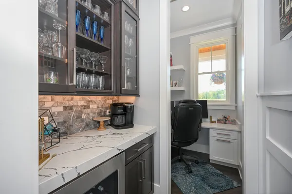 a kitchen with a sink stove and refrigerator
