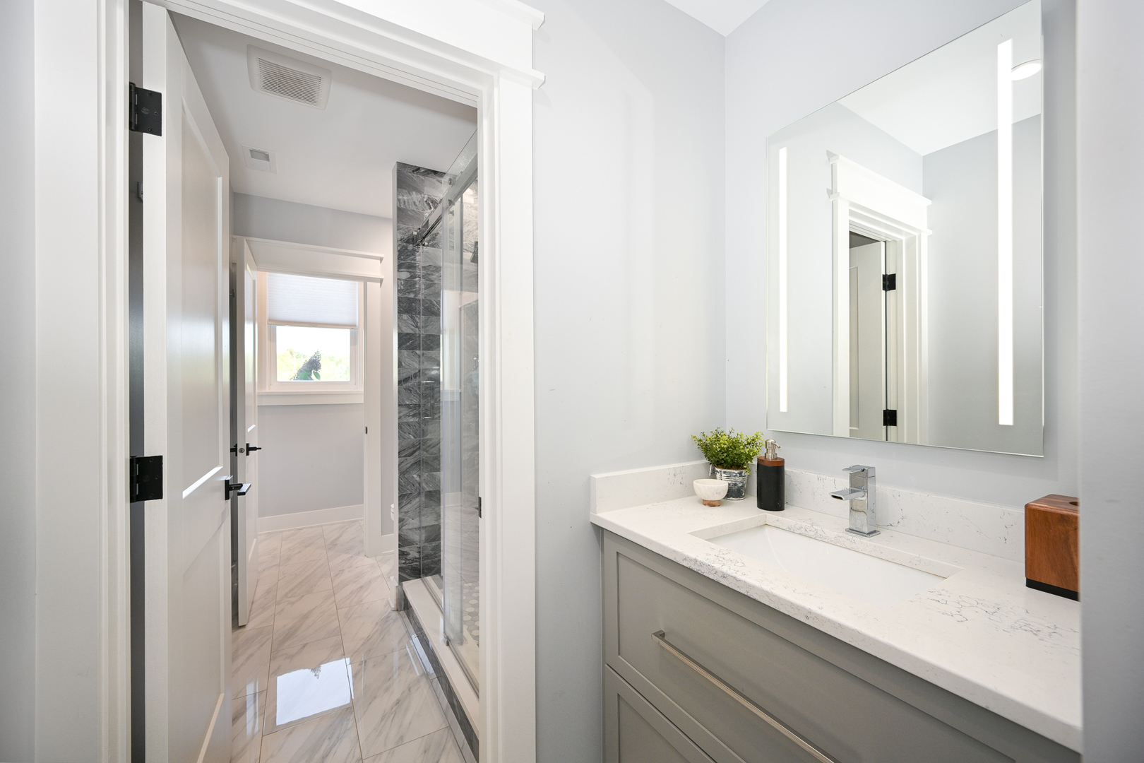 5-n107 Burr Road St. Charles, IL 60175 - Photo 37 of 54 a bathroom with a granite countertop sink and a mirror