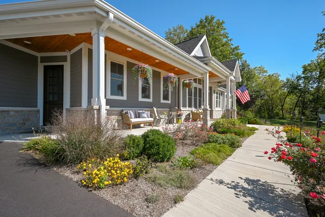 a kitchen with granite countertop a sink stainless steel appliances and cabinets