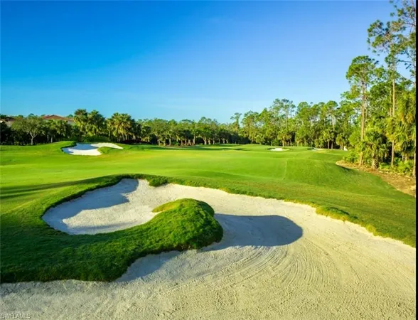 a view of a golf course with a lake