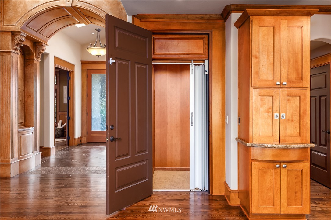 903 Belfair Road Bellevue, WA 98004 - Photo 26 of 36 a view of a hallway with wooden floor and entryway