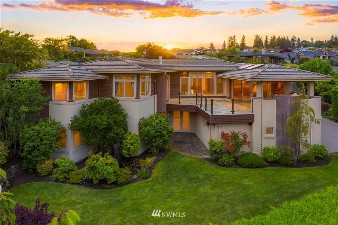 903 Belfair Road Bellevue, WA 98004 - Photo 30 of 36 a view of a white house with a big yard and potted plants
