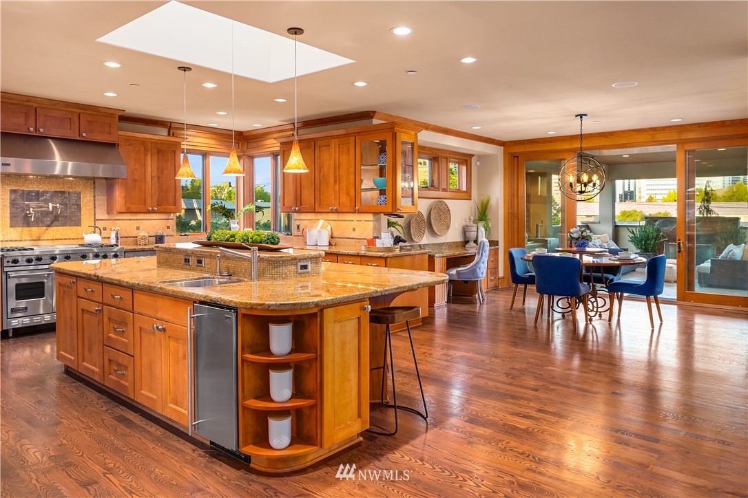 903 Belfair Road Bellevue, WA 98004 - Photo 4 of 36 a kitchen with stainless steel appliances granite countertop a stove and cabinets