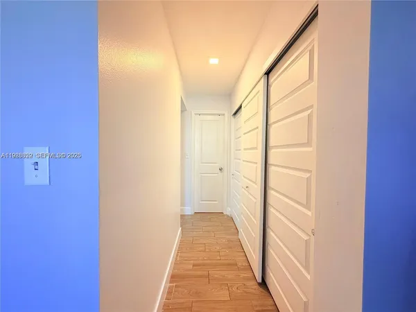 a view of a bathroom from a hallway