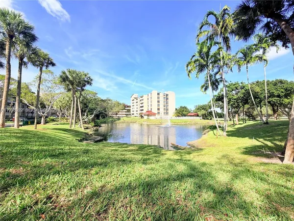 a view of a lake with a big yard
