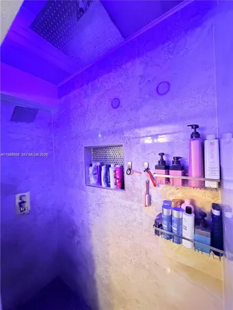 a view of a room with lots of furniture and clutter