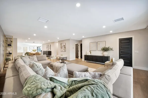a bedroom with a large bed and a large window