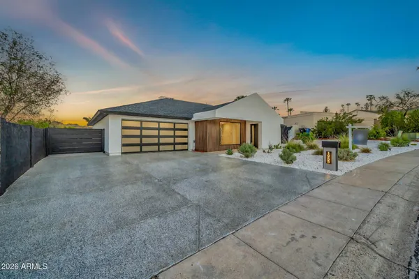 an aerial view of residential houses with outdoor space and street view