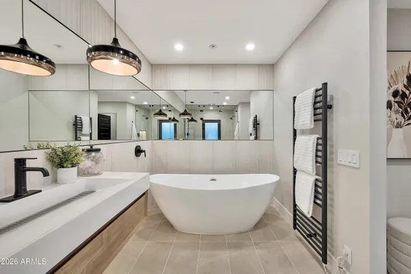 a bathroom with a sink toilet and mirror