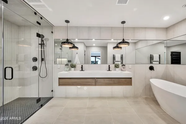 a view of swimming pool with lawn chairs under an umbrella