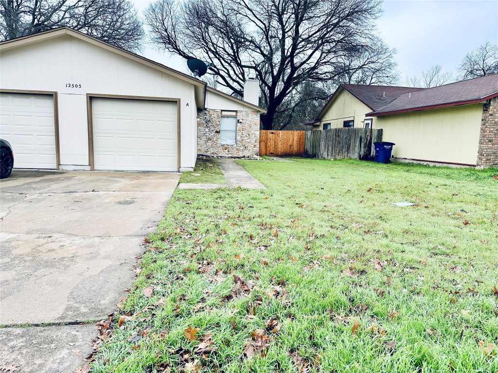 12505 Turtle Rock Road, Unit A Austin, TX 78729 - Photo 1 of 1 a front view of house with yard