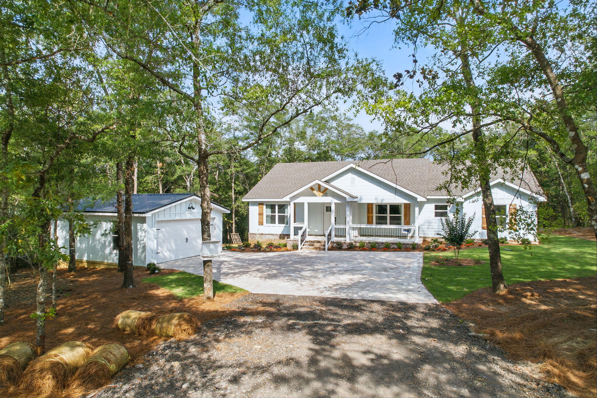 134 Deer Valley Road DeFuniak Springs, FL 32433 - Photo 3 of 82 a front view of a house with a garden