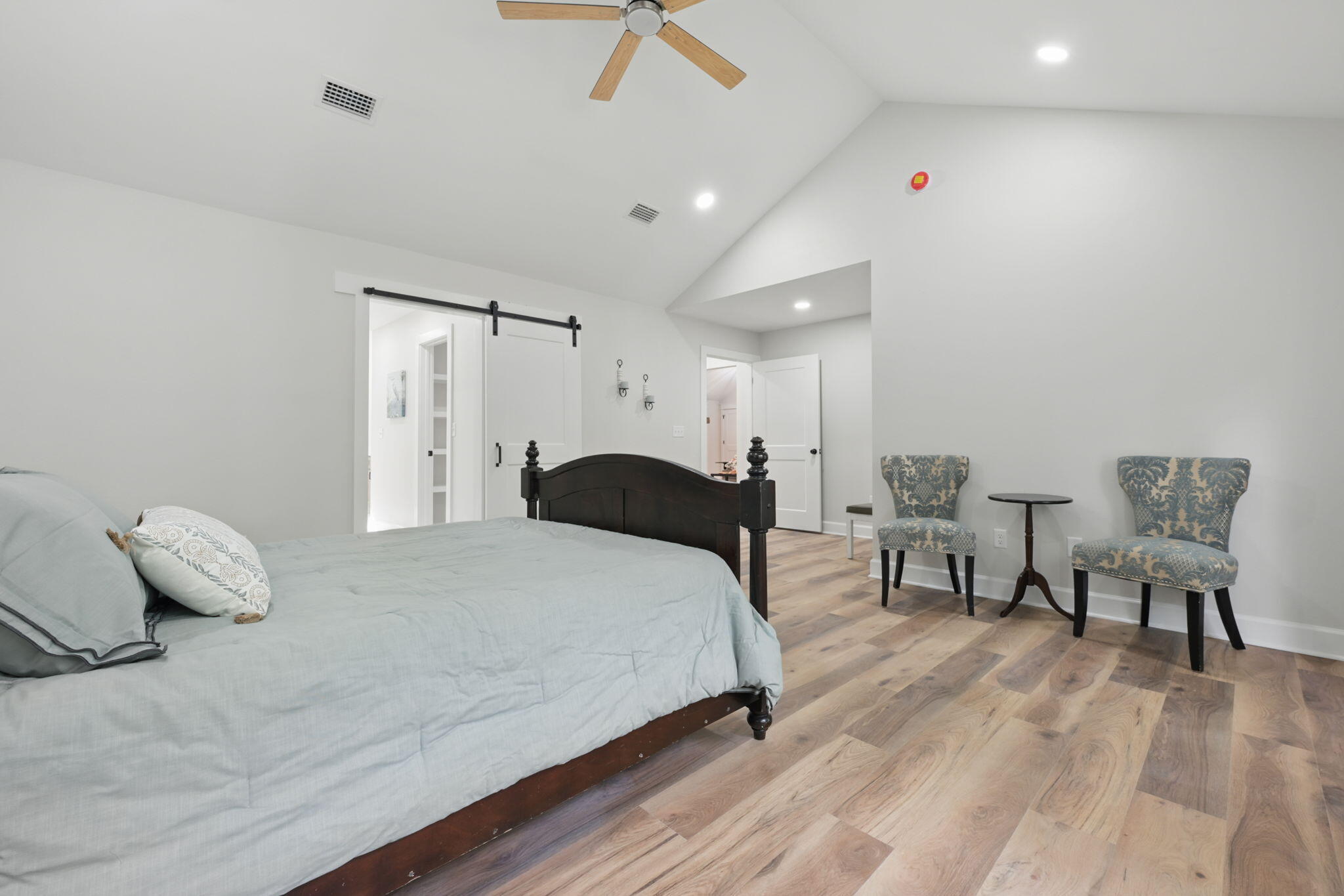 134 Deer Valley Road DeFuniak Springs, FL 32433 - Photo 35 of 82 a bedroom with a bed and a chair