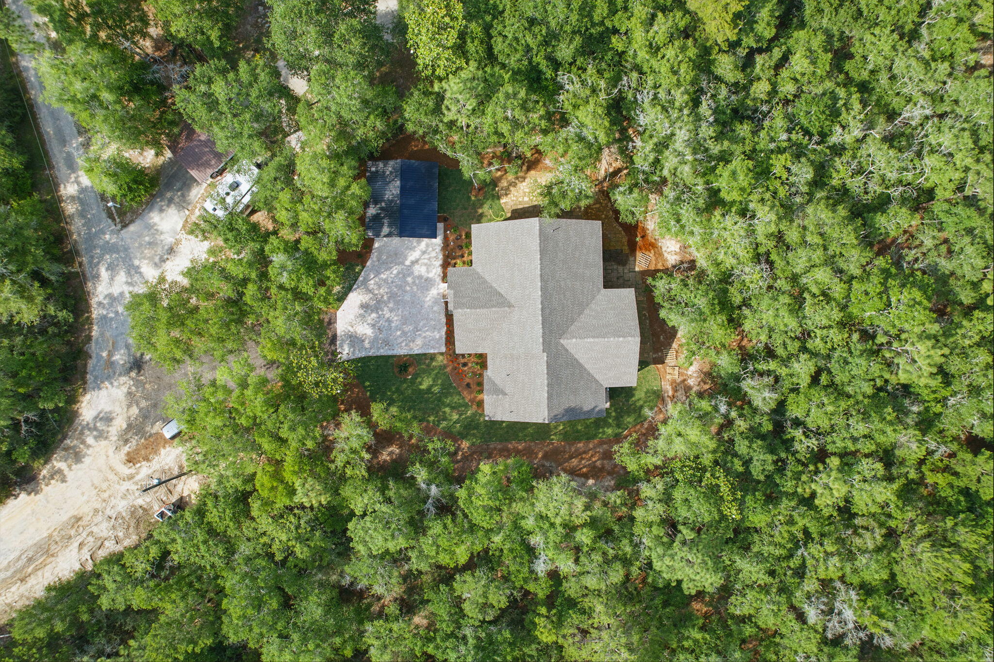 134 Deer Valley Road DeFuniak Springs, FL 32433 - Photo 73 of 82 an aerial view of a house with a yard and large trees