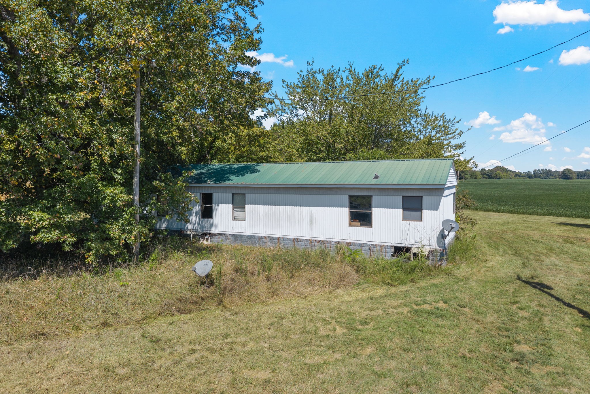 8127 Pleasant Hill Road Cross Plains, TN 37049 - Photo 16 of 24 a front view of a house with a yard