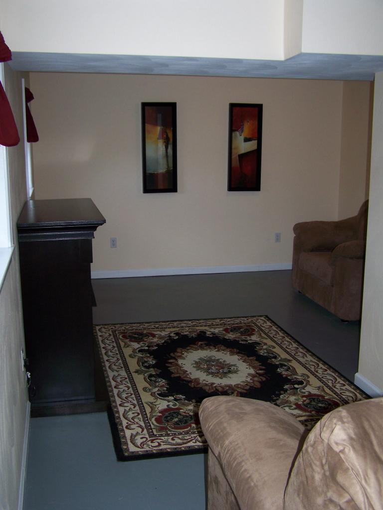 717 Kenyon Road Vinton, VA 24179 - Photo 12 of 16 a bedroom with a bed and a chair