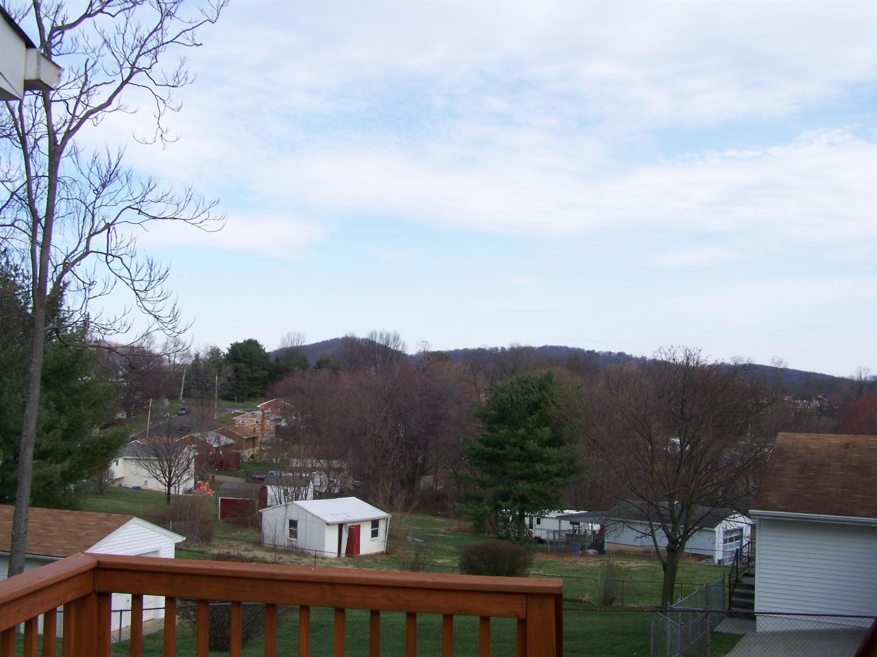 717 Kenyon Road Vinton, VA 24179 - Photo 6 of 16 a front view of a house with a yard and mountain view in back
