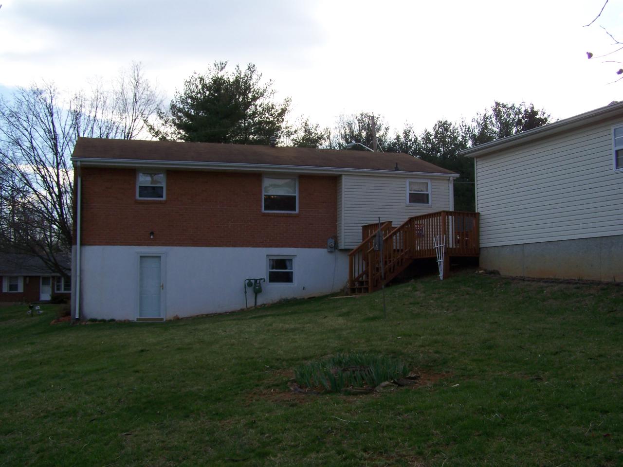 717 Kenyon Road Vinton, VA 24179 - Photo 7 of 16 a view of backyard with a barn and large trees