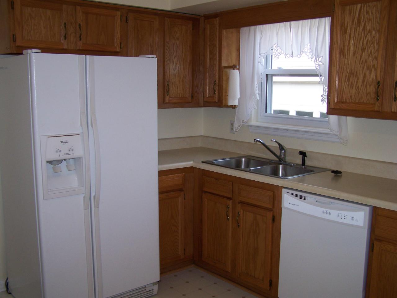 717 Kenyon Road Vinton, VA 24179 - Photo 9 of 16 a kitchen with a sink cabinets and a window