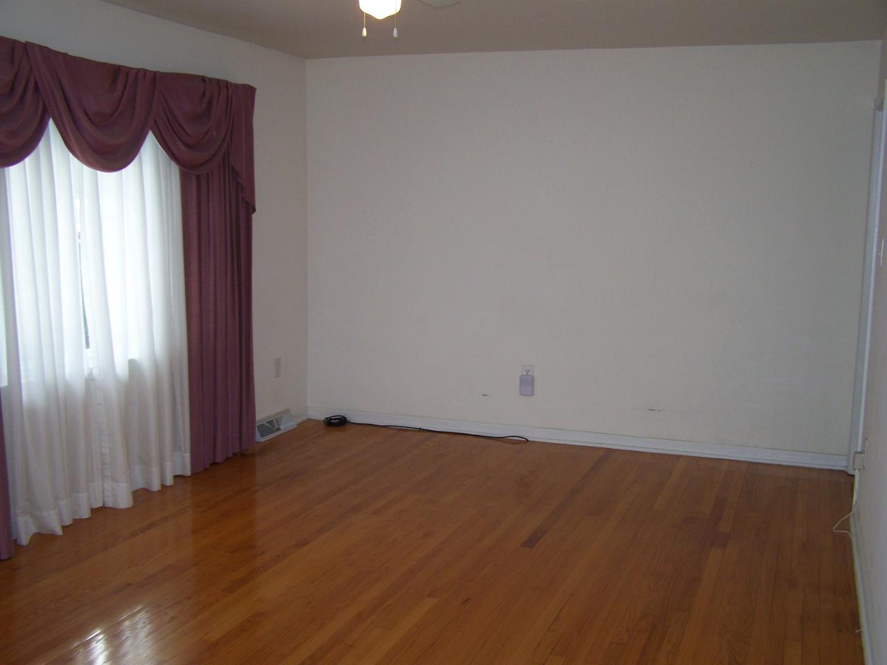 717 Kenyon Road Vinton, VA 24179 - Photo 10 of 16 an empty room with a window and a gate