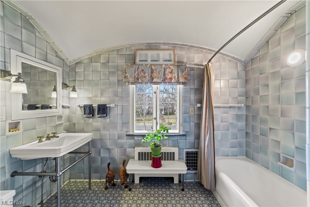 2745 Leighton Road Cleveland, OH 44120 - Photo 26 of 46 Bathroom featuring tile walls, lofted ceiling, and tile flooring